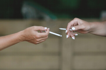 Women's hands with a cigarette