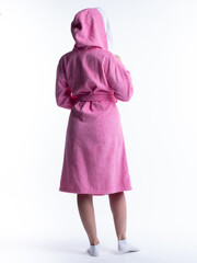 woman in a dressing gown from the back on an isolated white background.