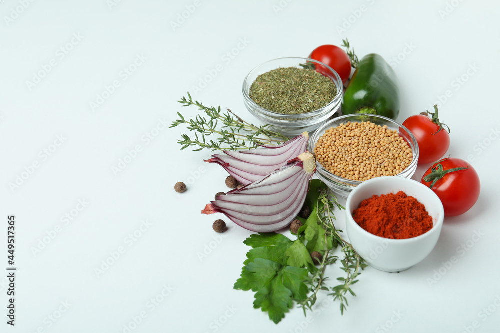 Poster Concept of aromatic spices on white background