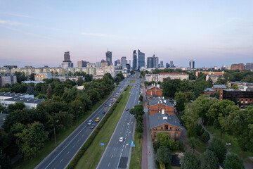 Warsaw by night. Amazing lights, skyscrapers and bridges over the Vistula River. View of the glowing lights in Warsaw from the drone. The capital of Poland miraculously shown at night.