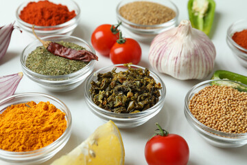 Concept of aromatic spices on white background