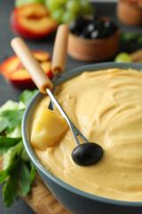 Concept of delicious food with fondue, close up