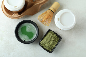Obraz na płótnie Canvas Concept of japanese tea with matcha on white textured table
