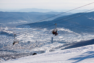 Naklejka na ściany i meble Ski cable car chair. Winter mountain natural landscape.