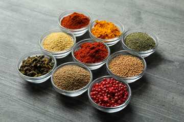 Set of different spices in glass bowls
