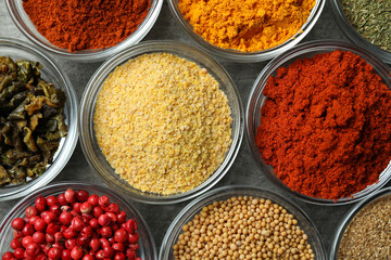 Set of different spices in glass bowls