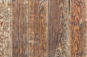 The surface of an old brown, cracked wood plank as a texture. The boards are vertical - obrazy, fototapety, plakaty