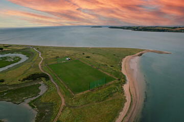 Aerial view of Pilmore Strand and the St Itas GAA pitch near Youghal in county Cork Ireland