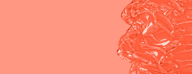 Liquid gel cosmetic smudge orange background. Antibacterial, hydro alcoholic gel, ethyl alcohol....