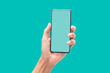 Hand holding smartphone with blank screen