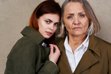 Mom and daughter in autumn coat fashion posing lifestyle