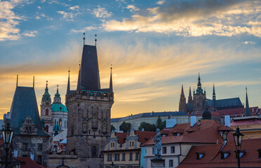 Fototapeta premium Prague by sunset, Lesser Town Bridge Tower and Prague Castle