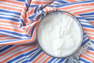 fresh yogurt in a bowl on table 