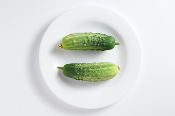 Two green cucumbers