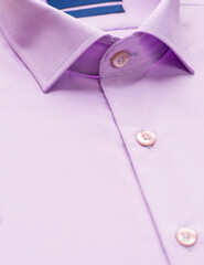 pink shirt with a focus on the collar and button, close-up