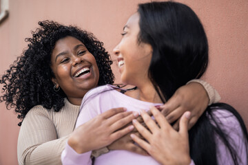 Happy Latin girls having fun embracing outdoor - Young people lifestyle and friendship concept