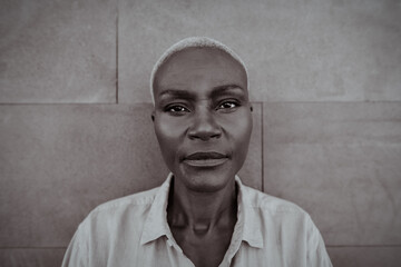 Black and white portrait of African middle aged woman - Elderly afro female looking in front of...