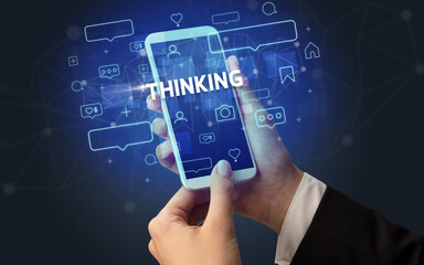 Hand using smartphone with social media concept