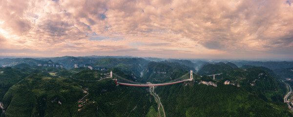 The Aizhai Bridge is a suspension bridge on the G65 Baotou–Maoming Expressway near Jishou, Hunan, China. It is also the world's highest and longest tunnel-to-tunnel bridge.