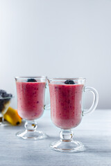 Banana-blackberry smoothie made from frozen fruits.