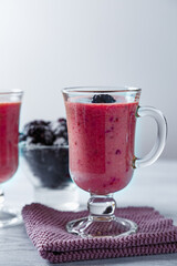 Banana-blackberry smoothie made from frozen fruits.