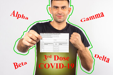 A man holds a coronavirus vaccination card and feels happy with protections of third dose of covid...