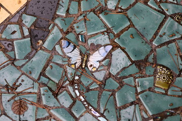 mosaic pattern including butterfly as background