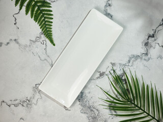 Rectangular plate on marble table top
