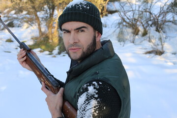 Hunter shooting in the snow