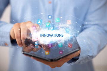 Businessman holding a foldable smartphone, technology concept