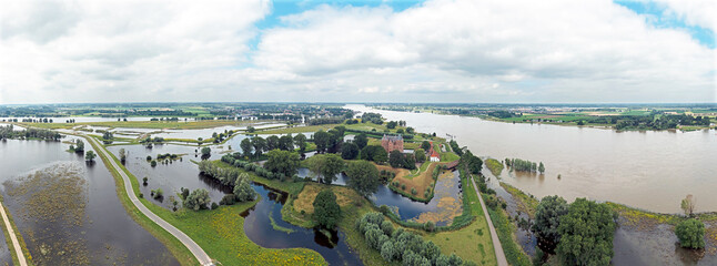 Aerial panorama from castle Loevestein at the river Merwede in a flooded landscape in the Netherlands