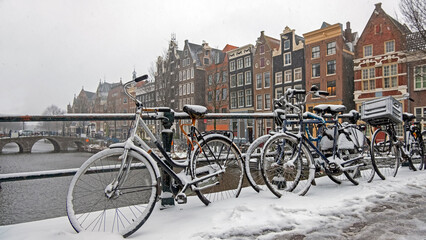 Fototapeta na wymiar City scenic from a snowy Amsterdm in winter in the Netherlands