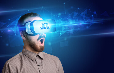 Businessman looking through Virtual Reality glasses, virtual security concept
