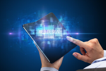 Businessman holding a foldable smartphone