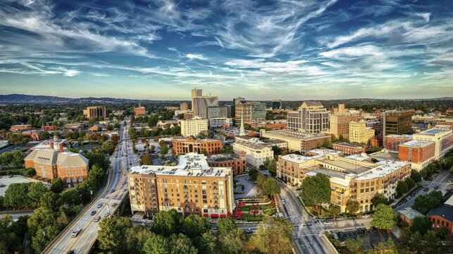 Panoramic view of downtown Greenville, SC cityscape under cloudy sky