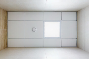 cassette suspended ceiling with square halogen spots lamps and drywall construction in empty room...