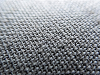 selective focus fabric texture on macro fabric sofa background image texture gray pattern interspersed with black