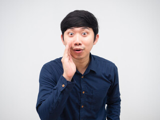 Asian man whisper at you hand up at his mouth portrait white background