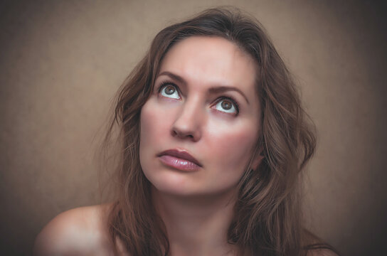 Closeup Portrait of a beautiful woman. Looking up