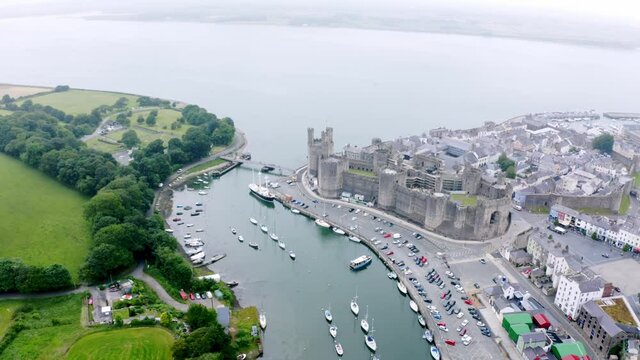Aerial drone shot of Caernarfon Castle, North Wales United kingdom.