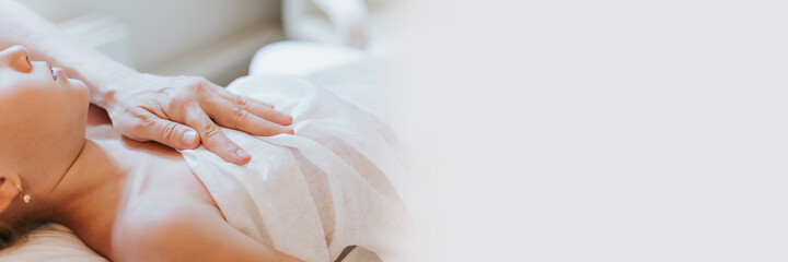 doctor osteopath hands does physiological and emotional therapy for eight year old kid girl. pediatric osteopathy treatment session. alternative medicine. taking care of the child's health. banner