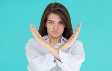 Beautiful young european woman say no on blue background