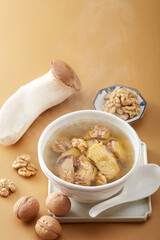 Delicious chicken soup with Pleurotus eryngii and walnut kernel
