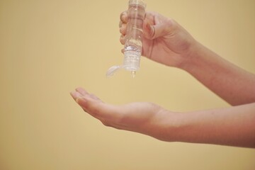 Close up of a hand using hand sanitizer.