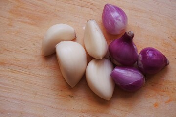 Garlic and onion with wooden background from several angle.