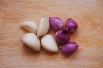 Garlic and onion with wooden background from several angle.