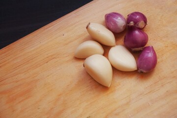 Garlic and onion with wooden background from several angle.