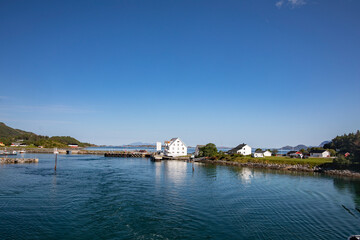 Fototapeta premium The car ferry MF Heilhorn leaves Vennesund ferry berth,Helgeland,Nordland county,scandinavia,Europe