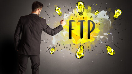 man drawing colorful light bulb