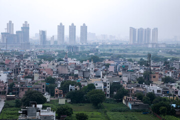 Obraz premium aerial landscape view of Dwarka Expressway, showing the contrast of villages and tall building.